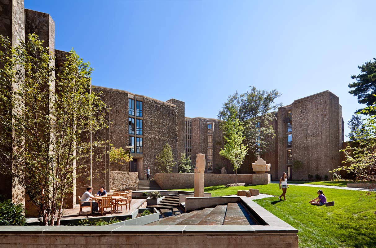<p>New site walls terrace the courtyard and negotiate the grade down to the main entry and dining hall. A water feature and deck are popular with students. <br><small>&copy; Peter Aaron/OTTO</small></p>