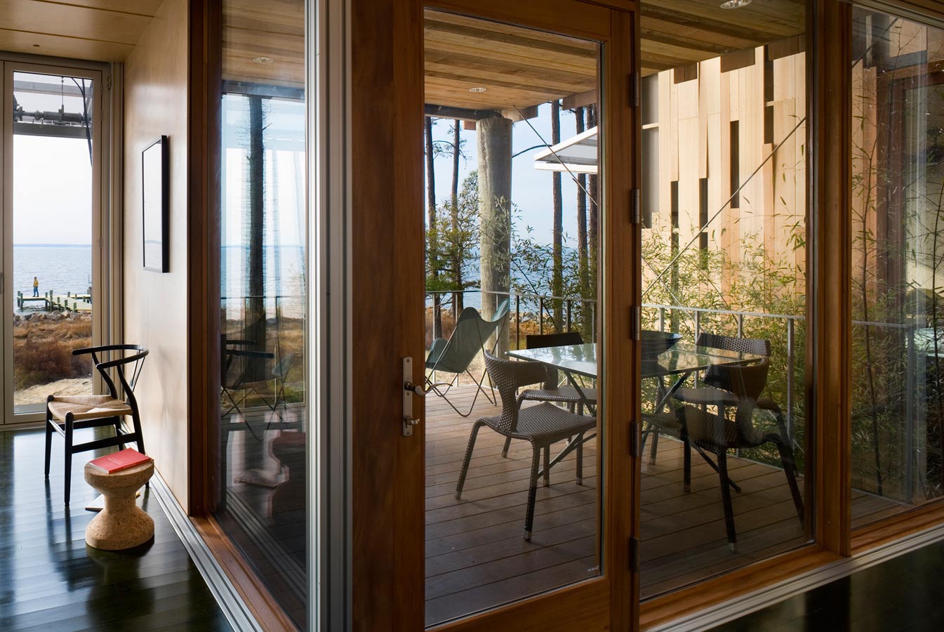 <p>The covered deck outside the master bedroom, with bamboo garden and guest wing beyond. <br><small>&copy; Peter Aaron/OTTO</small></p>
