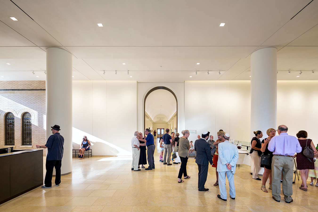 <p>The new southern entrance's lobby provides direct connections to the historic Thalhemier Lobby, as well as all of the synagogue's religious, educational, meeting, and social spaces. <br><small>&copy;James Ewing Photography</small></p>