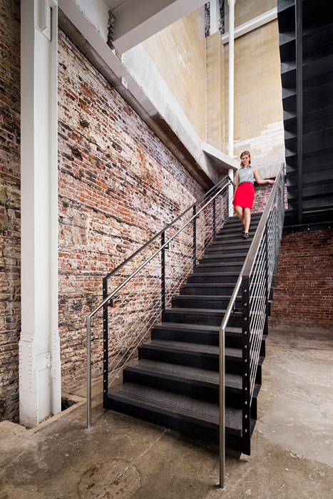 <p>Elements of the building that make it recognizable as a former bottling plant were restored, including interior and exterior brick. <br><small>&copy; Michael Moran/OTTO</small></p>