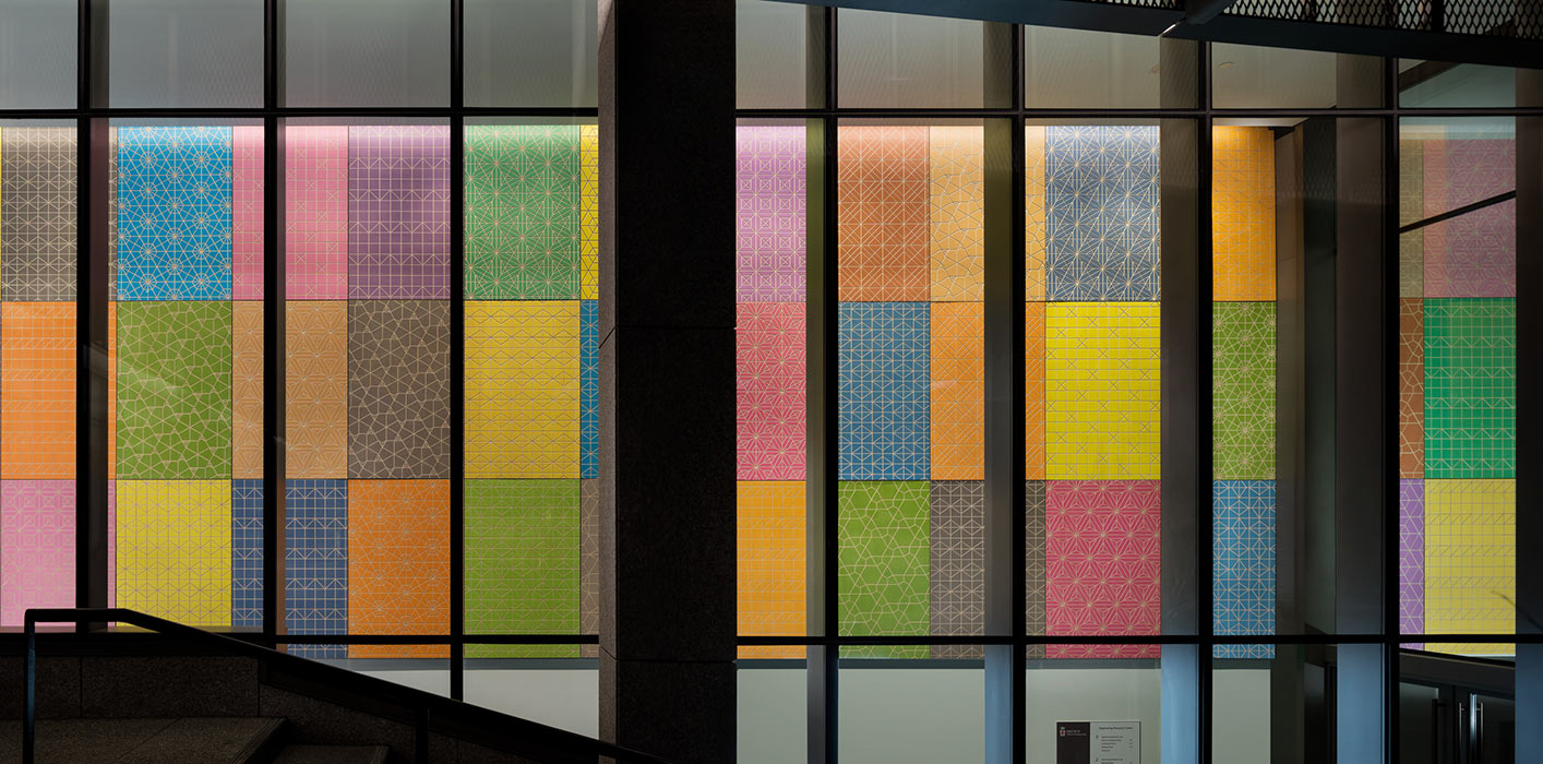 <p>The centerpiece of Spencer Finch's artwork is a dyed and engraved plywood installation that hangs in a ground-level corridor and is visible from the exterior. <small>&copy;Warren Jagger</small></p>