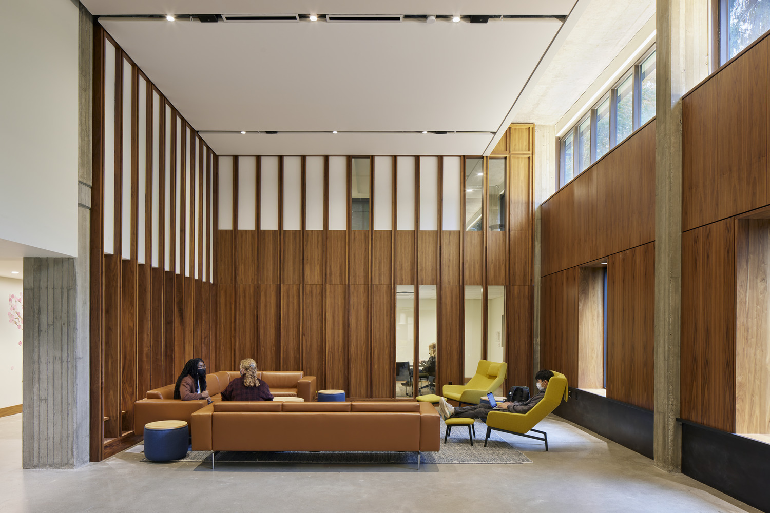 <p>The McCarty Hall community lounge serves as a living room for all students in the building. The double height space creates a sense of openness while providing shared student space, meeting rooms, and a group kitchen. | <small>&copy; Bruce Damonte</small></p>