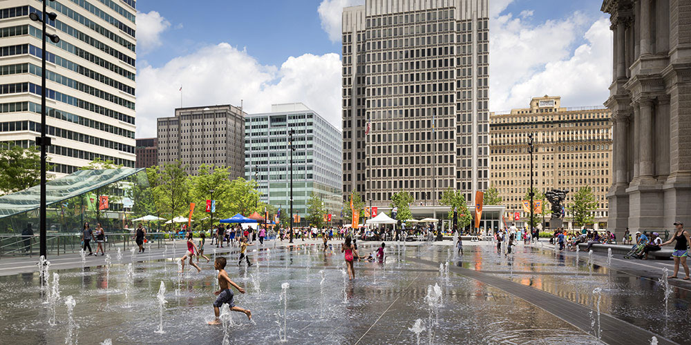 <p>The public fountain, made up of 3/8-inch sheets of water fed by collected and purified rainwater, attracts citizens of all ages to the park. <br><small>&copy; James Ewing Photography</small></p>