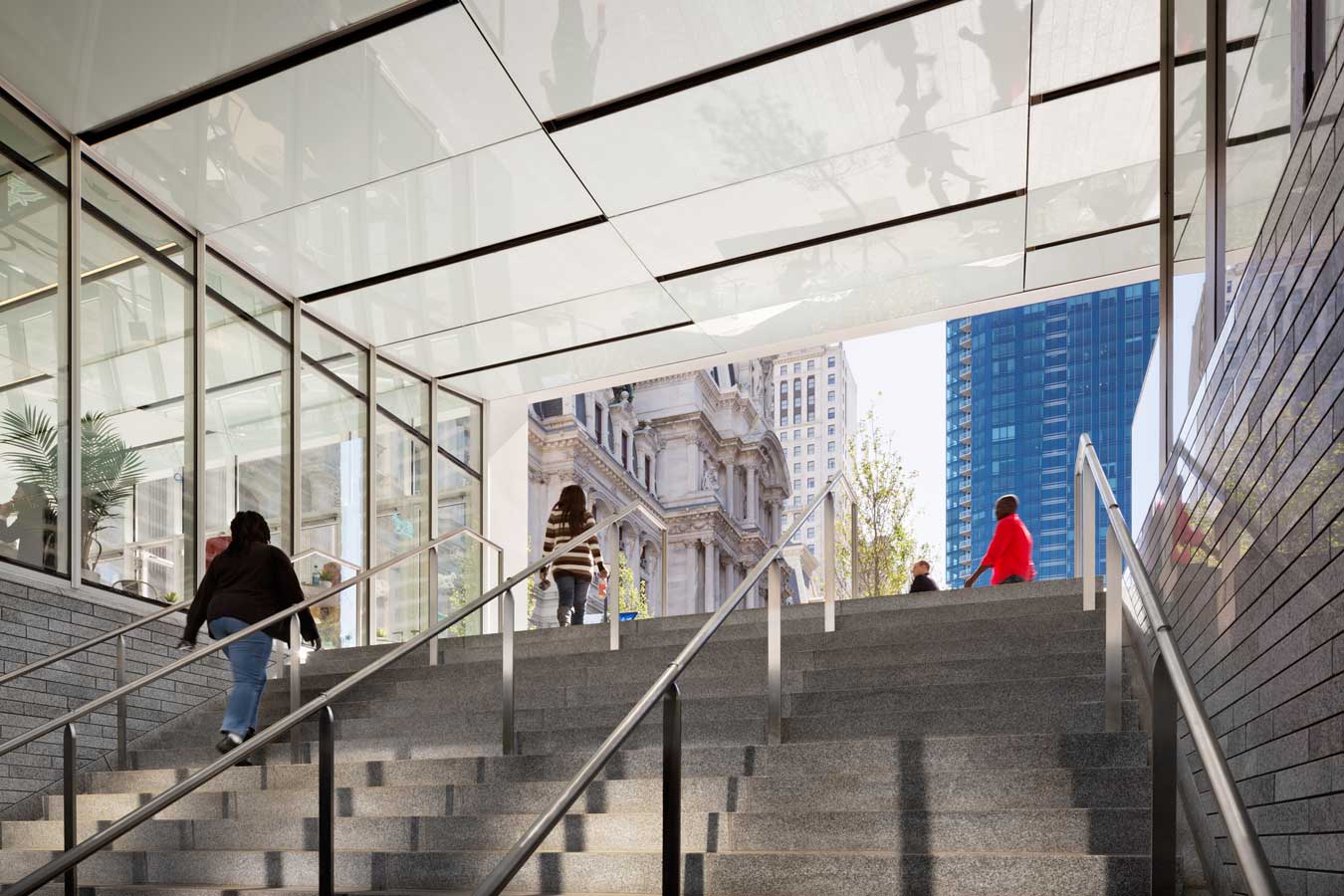 <p>As one emerges from the concourse, the transit entries frame new views of City Hall, stirring renewed appreciation for the grandeur of this part of the city. <br><small>&copy; James Ewing Photography</small></p>