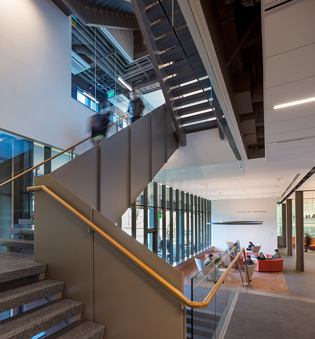 <p>A folded metal and stone stair joins the lab floors to the open commons space, which brims with activity day and night. <small>&copy;Warren Jagger</small></p>