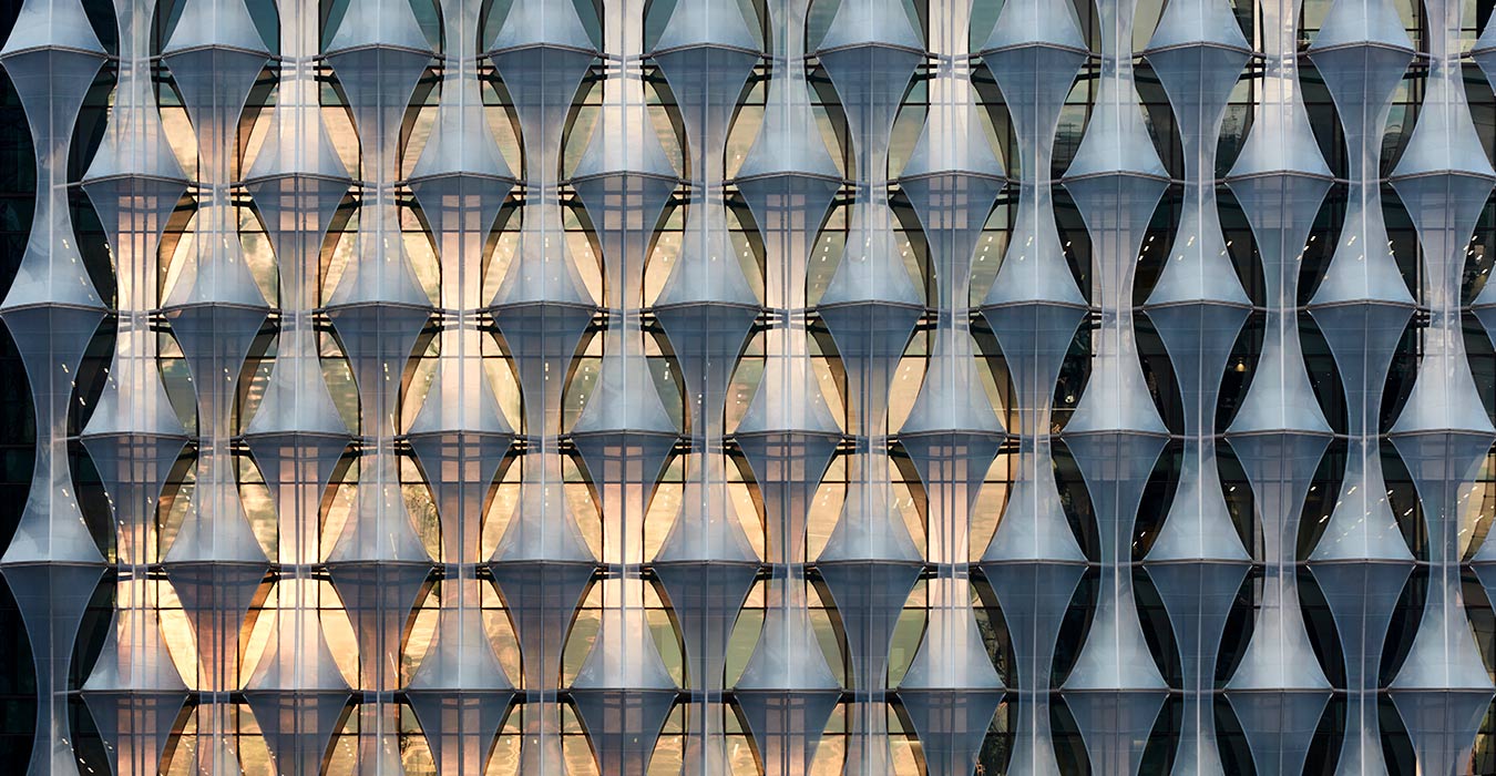 <p>The glazing on the Embassy's multi-layer facade reflects the London sky, creating an envelope whose tonality shifts with the weather and time of day.<small><br> &copy;Richard Bryant</small></p>