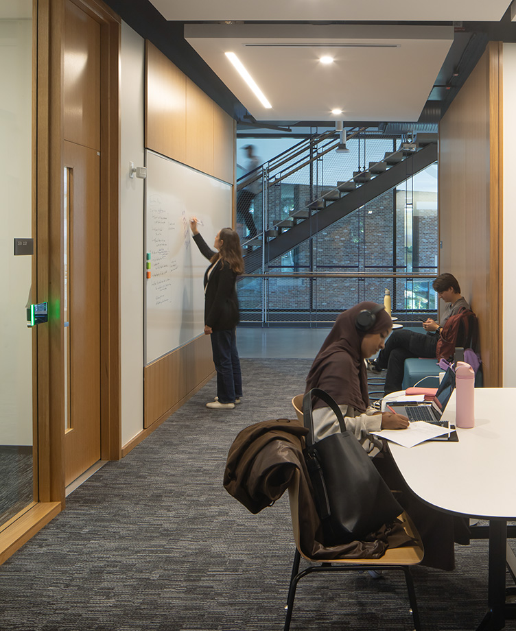 University of Washington Interdisciplinary Engineering Building Level 1 interior student lounge and stair, looking south to courtyard